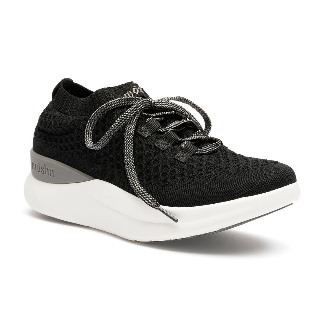 A pair of black 21040639_1pair_hi-res_SQ sneakers with lace-up closure, featuring a textured upper and a white sole.