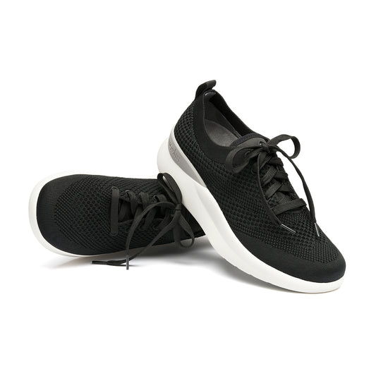 Leap wingtip shoe with a sleek design, featuring a SmartKnit¨ water-resistant upper and Dynamic Motion Technology¨ for stability and propulsion.