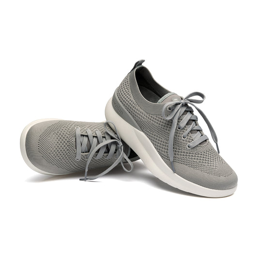 Leap wingtip shoe with a sleek design, featuring a SmartKnit¨ water-resistant upper and Dynamic Motion Technology¨ for stability and propulsion.
