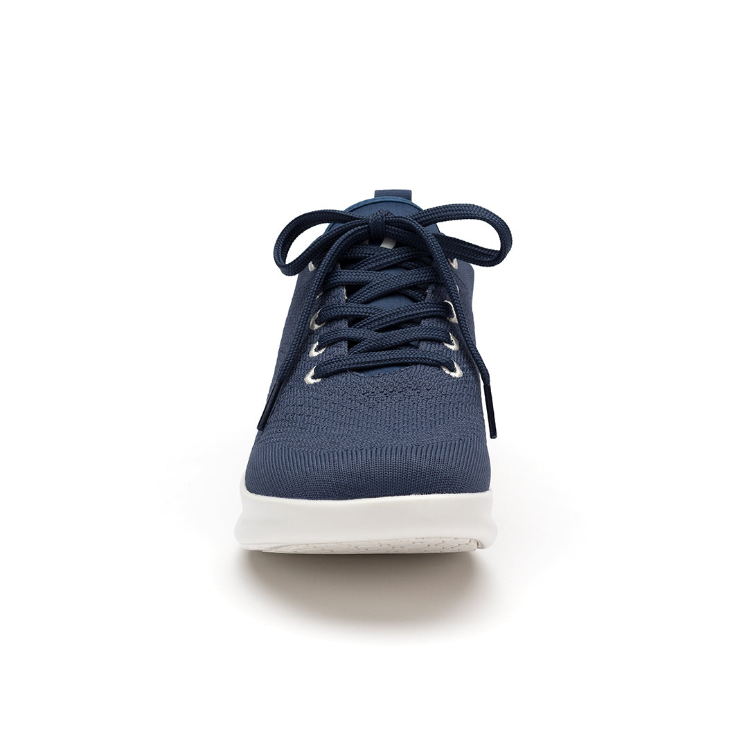Leap shoe toe close-up, highlighting the enhanced toe spring for natural movement and wingtip detailing for a polished look.