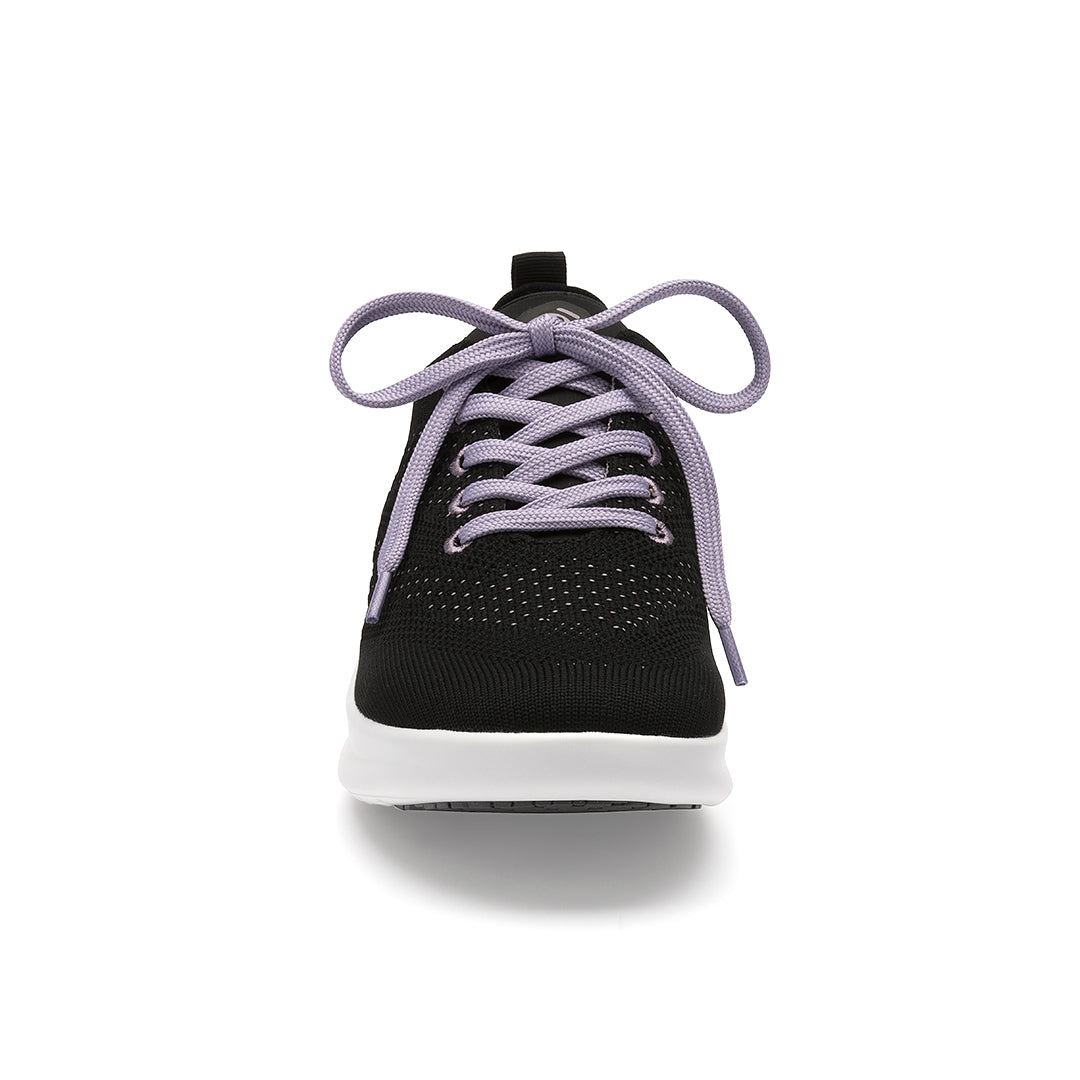 Leap shoe toe close-up, highlighting the enhanced toe spring for natural movement and wingtip detailing for a polished look.