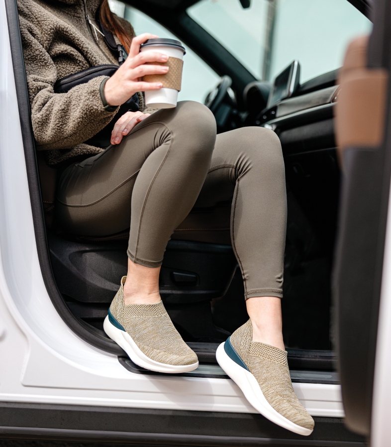 Person Getting out of car while using a pair of Green Slip-on Shoes