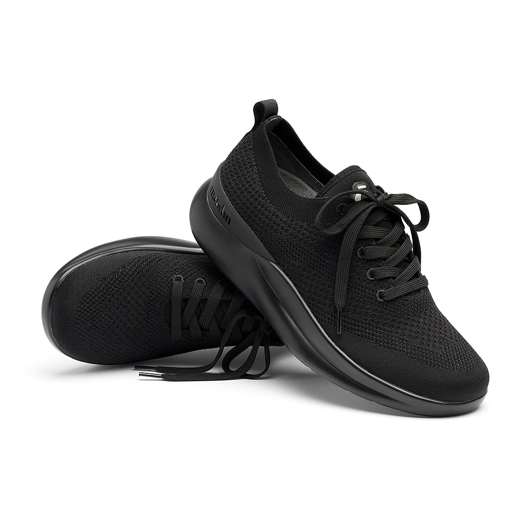 Leap wingtip shoe with a sleek design, featuring a SmartKnit¨ water-resistant upper and Dynamic Motion Technology¨ for stability and propulsion.