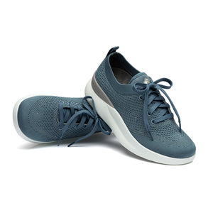 Leap wingtip shoe with a sleek design, featuring a SmartKnit¨ water-resistant upper and Dynamic Motion Technology¨ for stability and propulsion.